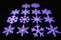 Set of 12 unique 3D printed white snowflake ornaments fresh off the Bambu printer build plate