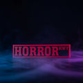 3D printed Horror Hwy street sign in red and black displayed in front of Fourth Wing and other BookTok books on a shelf