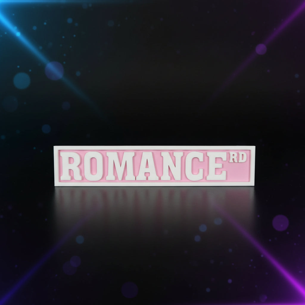 3D printed Romance Rd street sign in pink and white displayed in front of Fourth Wing and other BookTok books on a shelf