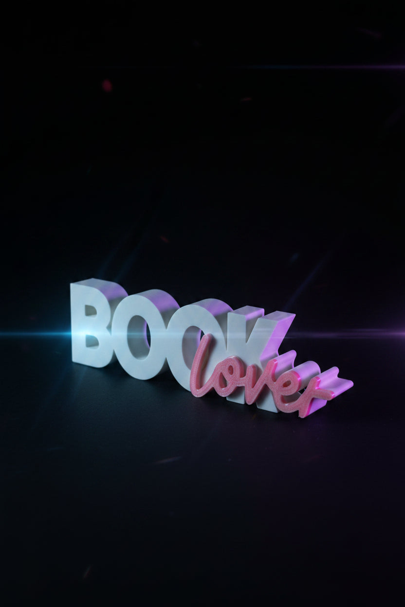 3D printed Book Lover sign standing upright with dried floral arrangement
