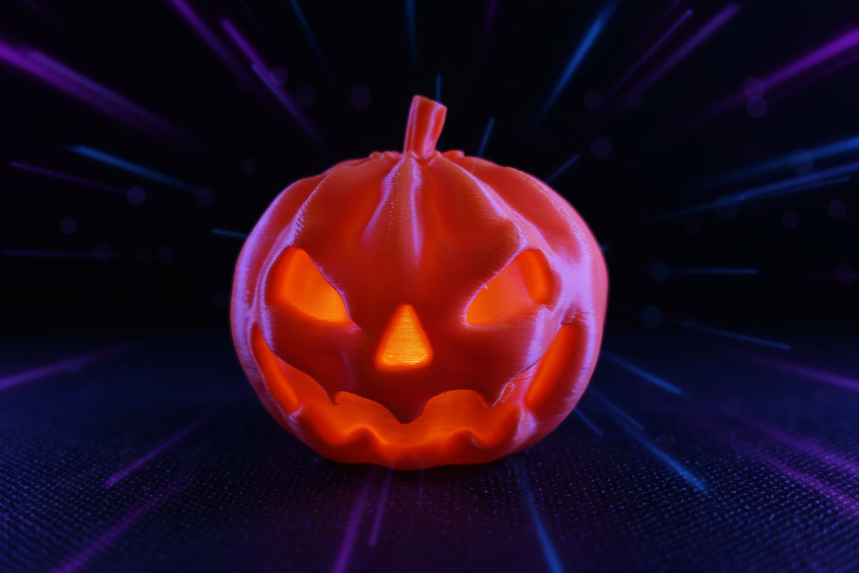 3D printed single-color orange pumpkin tow hitch cover close-up on table