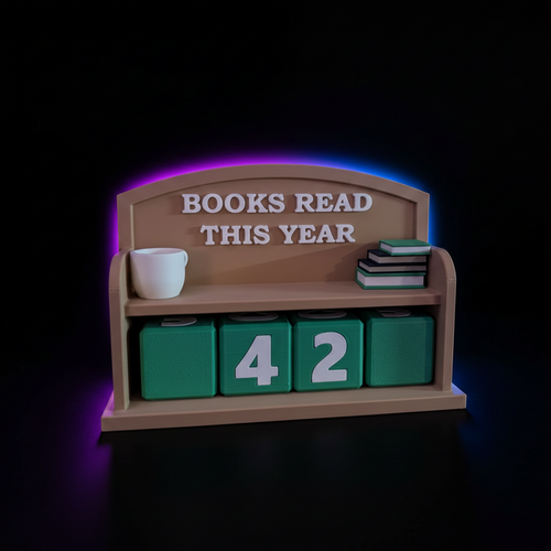 3D printed Books Read This Year counter display showing 42 on teal number blocks in front of colorful bookshelf