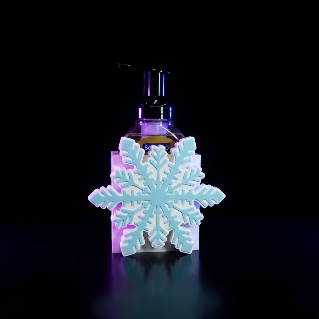 3D printed snowflake BBW interchangeable soap cover in white and icy blue on a foaming Softsoap dispenser - styled with greenery and wood cutting board