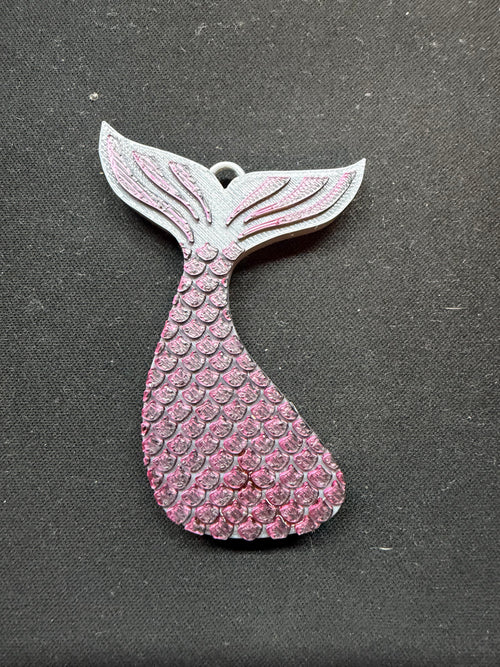 3D printed mermaid tail soda can opener in pink with detailed scale texture