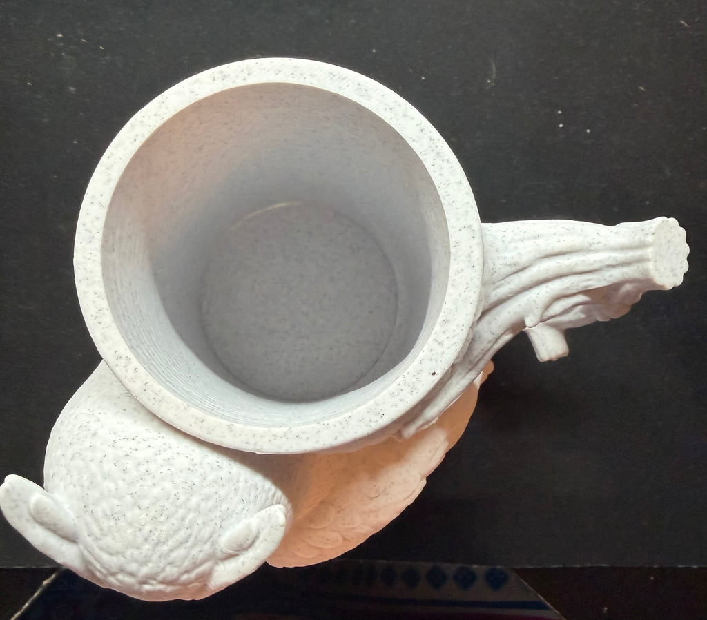 3D printed owl can holder front view showing detailed face, feathers, and branch handle